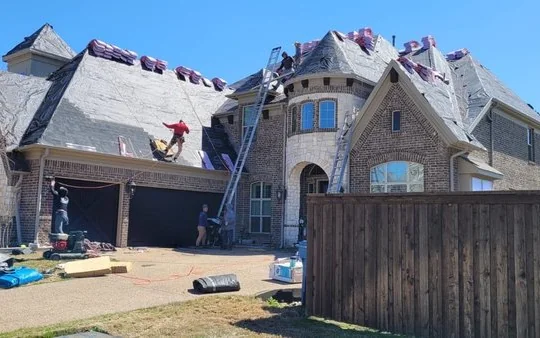 Frame Restoration crew working on residential roof replacement in Texas